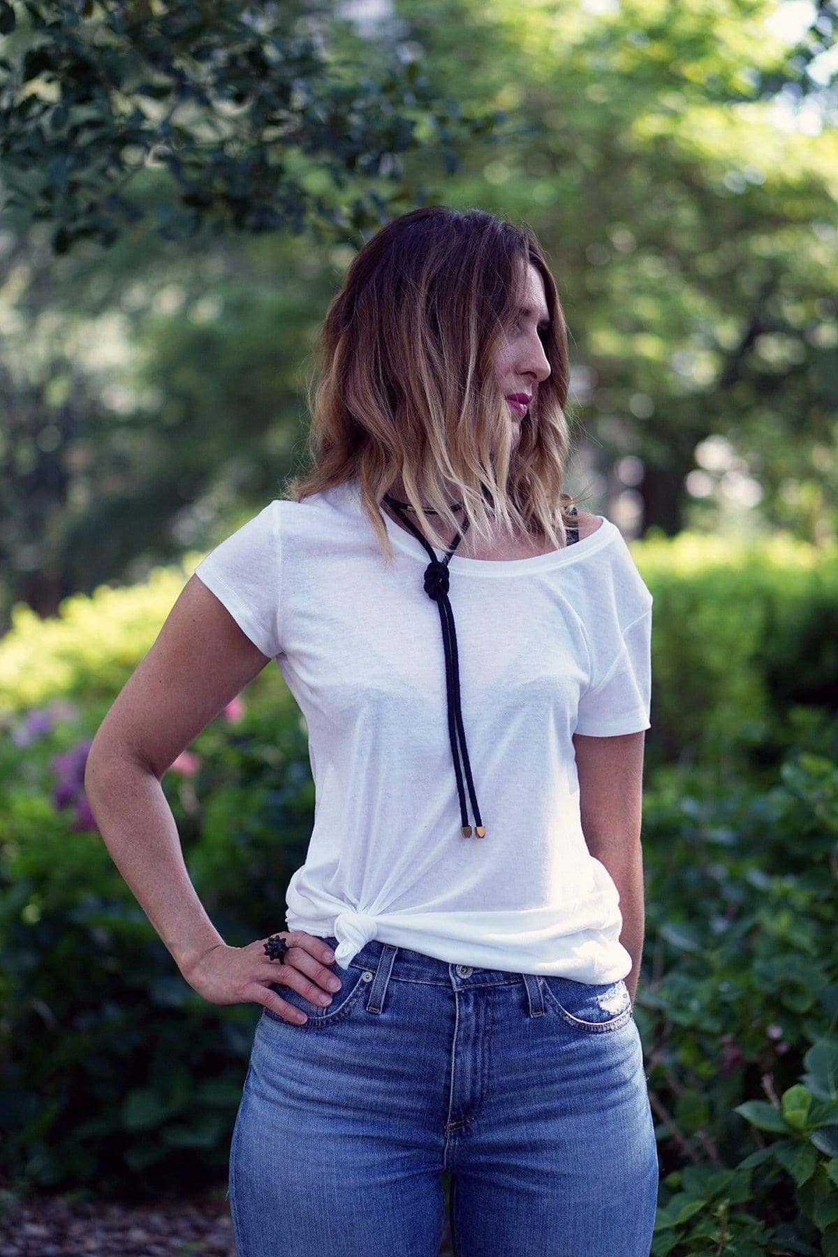 Three simple ways to breathe new life into a plain t-shirt | A white tee is a wardrobe staple, tie it in a knot to add shape, tuck it into your favorite party skirt for everyday, and layer it under a dress