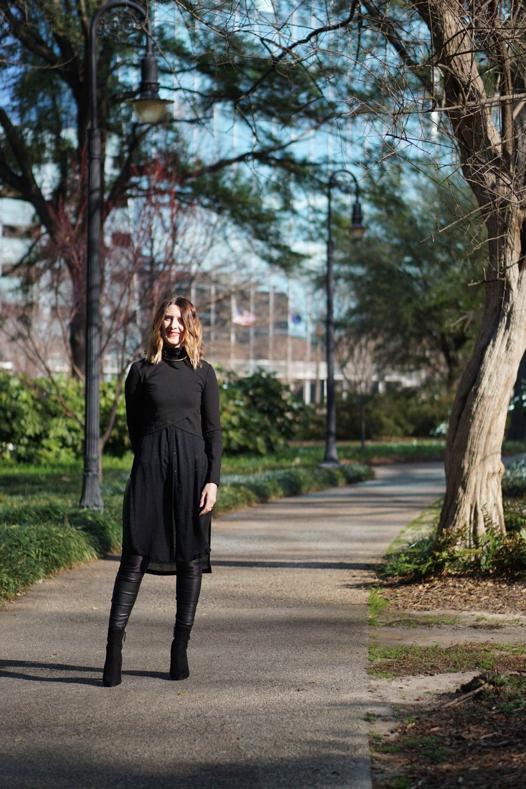 4-reasons-to-have-sheer-clothes-in-your-closet-1 a black top worn with black faux leather pants