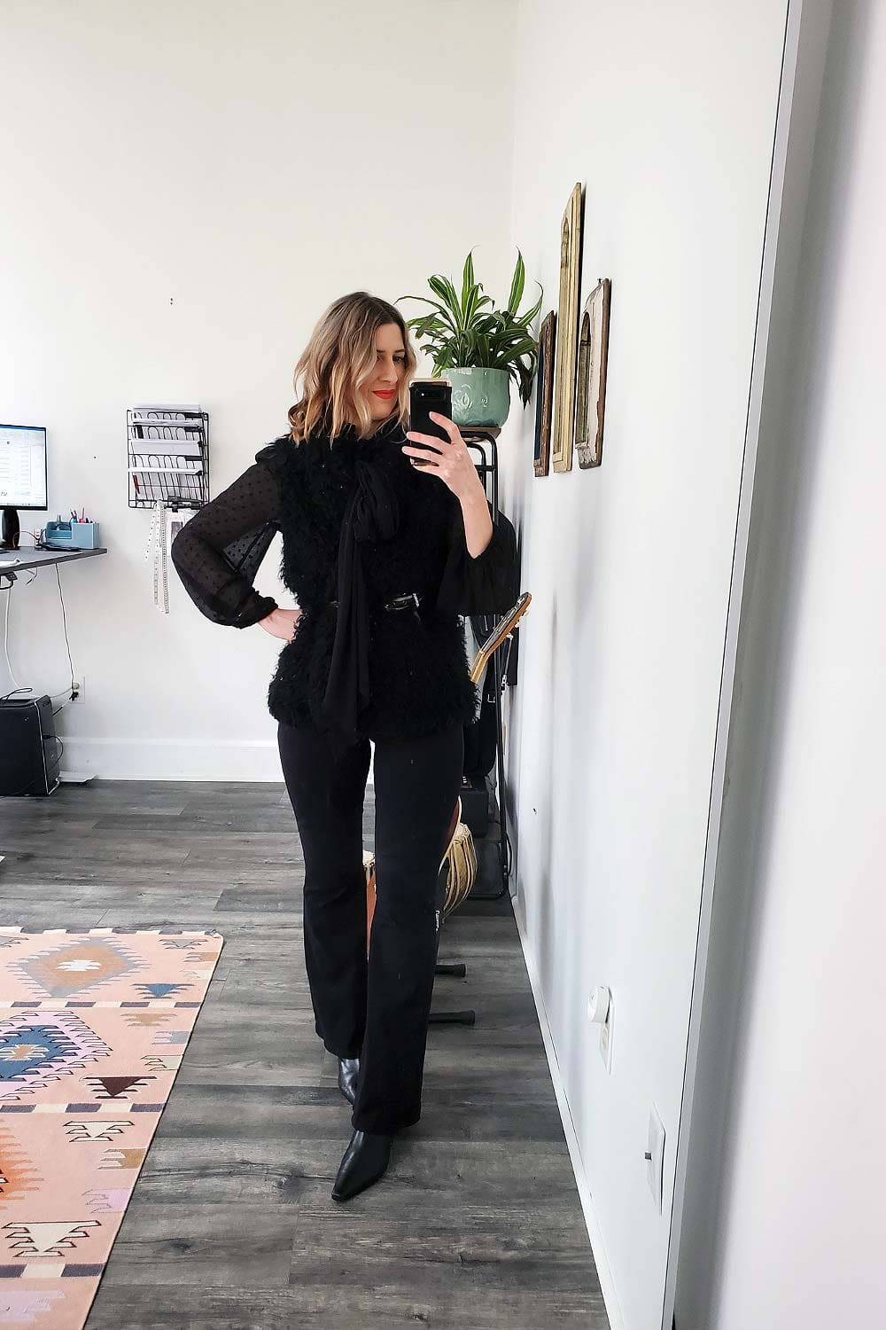 An image of a women wearing skinny flares with ankle boots