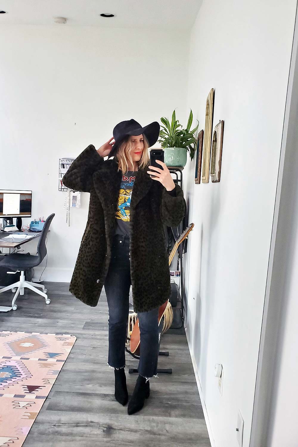 A women wearing cropped kick flare jeans with anke boots