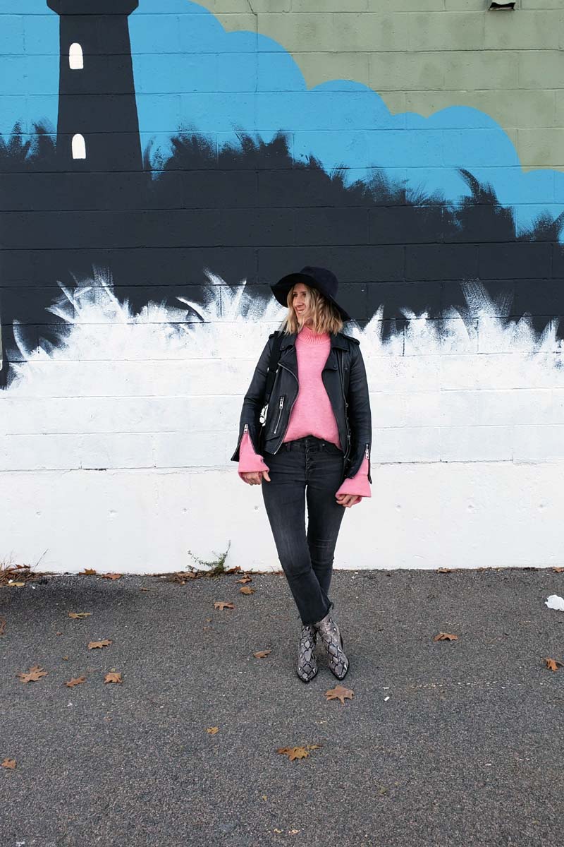 Image of a women wearing ankle boots with cropped jeans