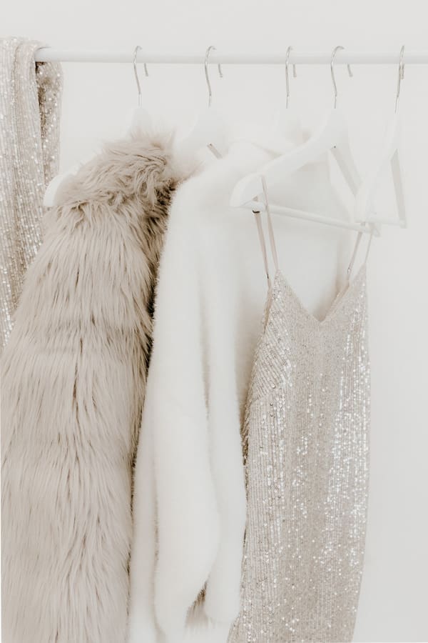 the-best-cocktail-dresses-for-hourglass-shapes A clothes rack with a faux fur coat and sequin dress perfect for an hourglass shape hanging on it
