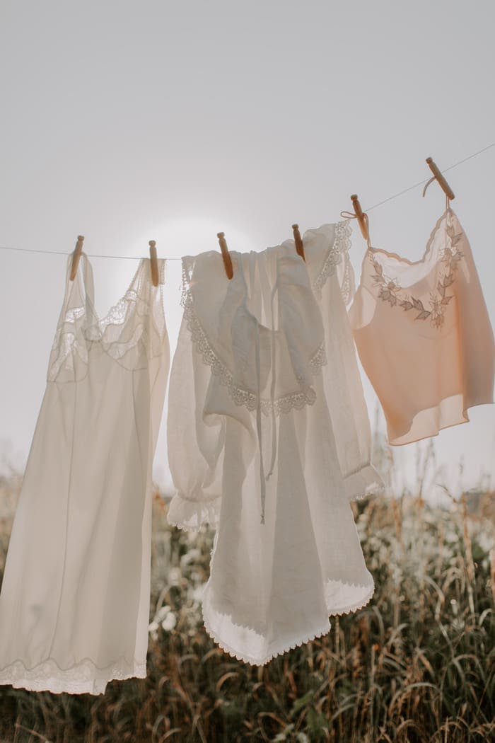 sheer clothing for an hourglass body shape, hanging on a washing line in the sunshine